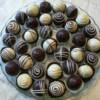 A platter of chocolate and vanilla cake truffles.